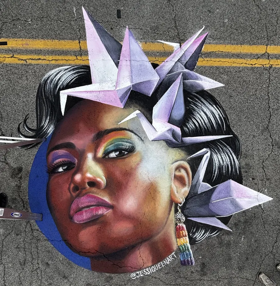 Chalk portrait of a Black woman wearing a crown of lavender origami cranes