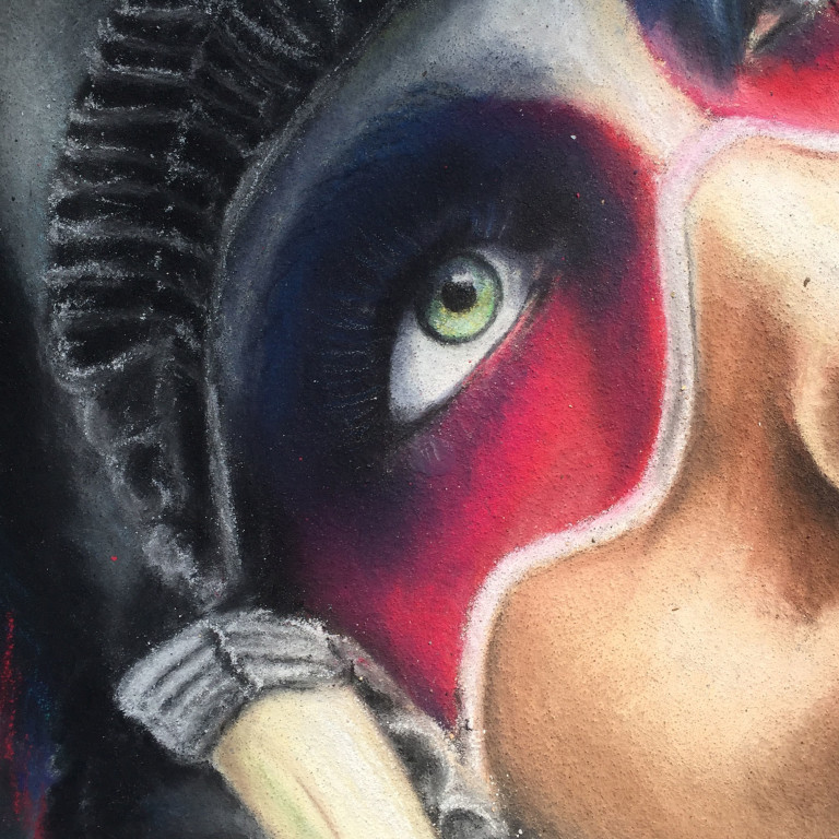 Close-up of the chalk portrait's green eye framed by red and blue face paint and a feathered headdress