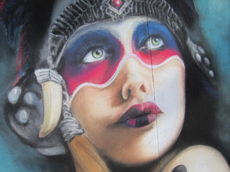 Close-up of the finished portrait's face, with blue eyes, red and blue face paint and dark lips