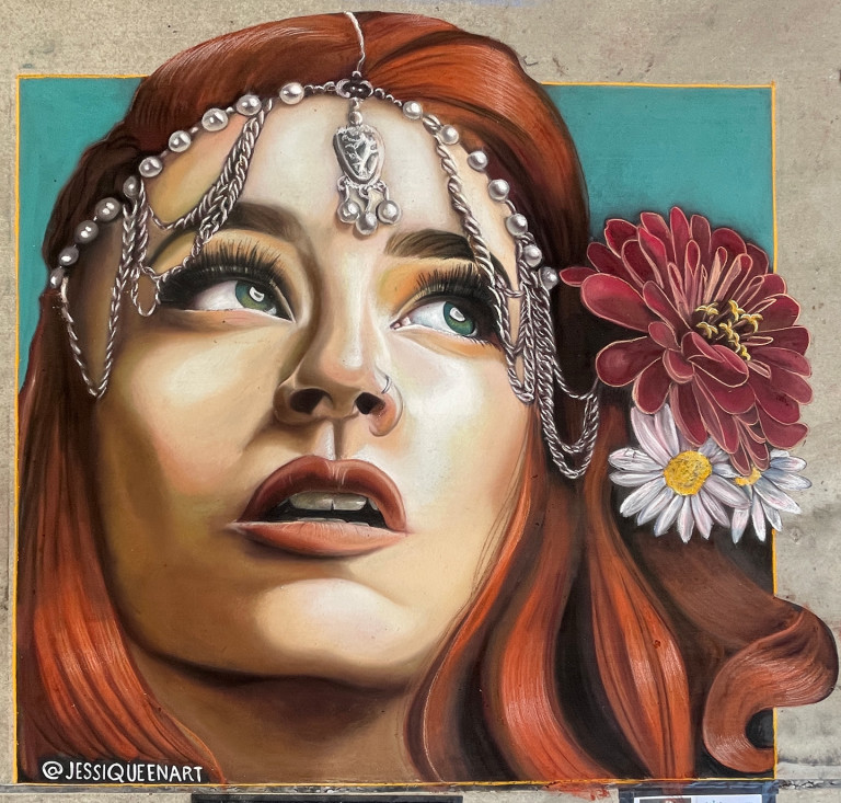 Chalk portrait of a red-haired woman in a jeweled headpiece with red and white flowers