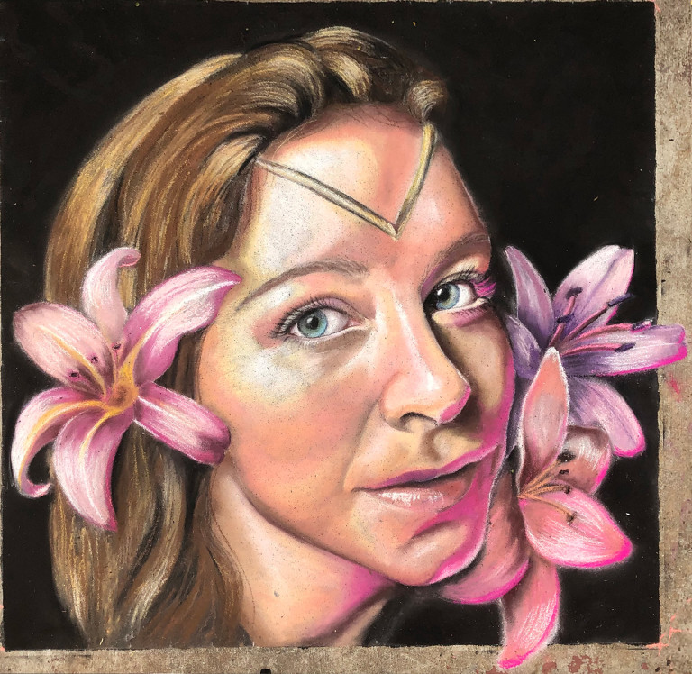 Chalk portrait of a woman with a gold headpiece and pink lilies at her cheeks