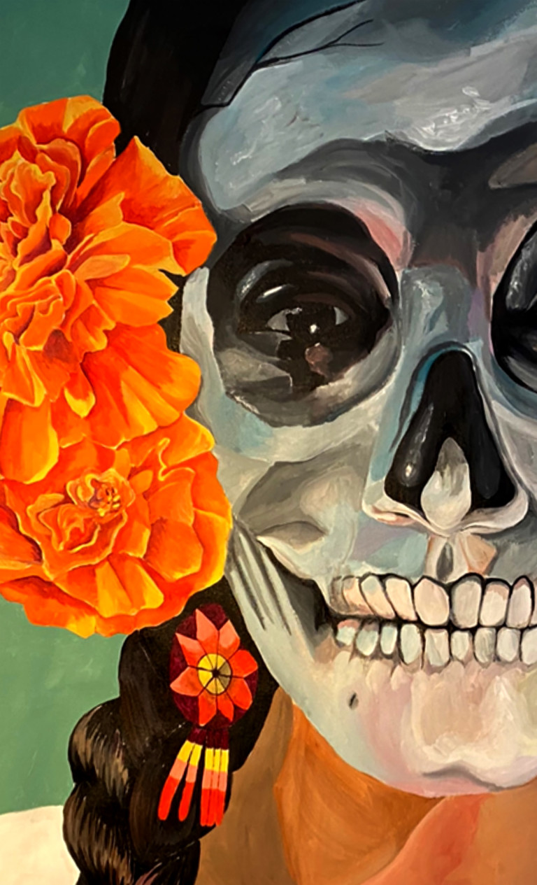 Close-up of the Dia de los Muertos mural showing marigolds and a beaded braid