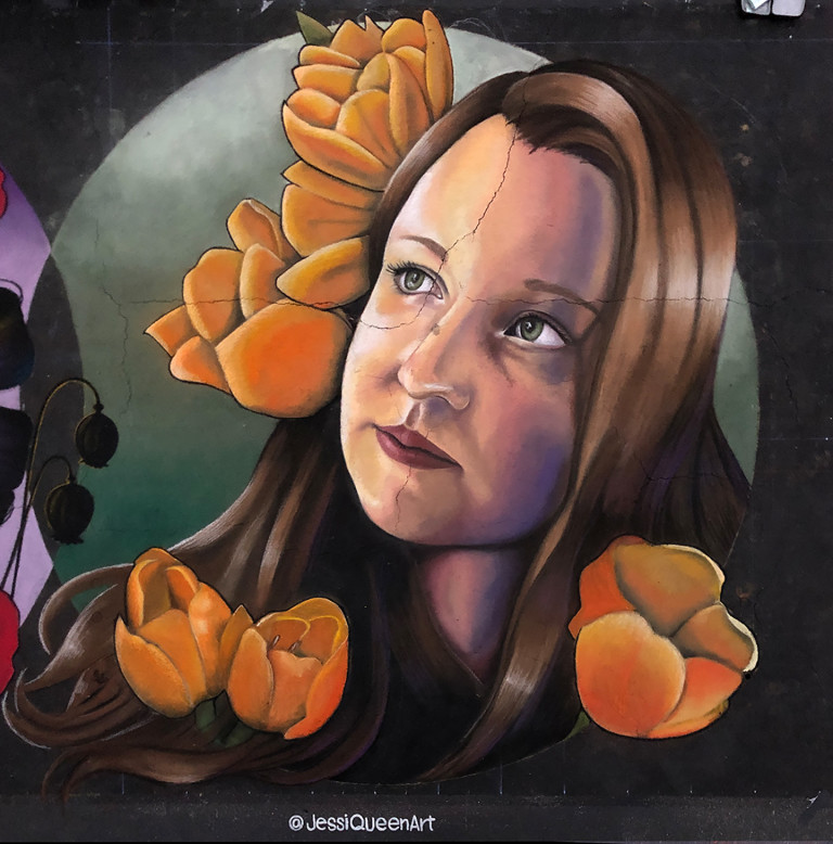 Chalk portrait of a woman with long brown hair surrounded by orange tulips