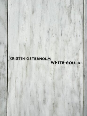 Kristin Osterholm White Gould's name on a white marble panel of the Wall of Names