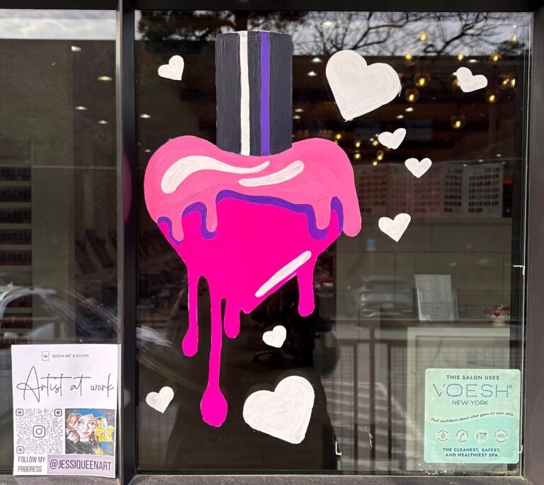 Valentine's window painting of a pink heart-shaped nail polish bottle dripping polish, surrounded by white hearts
